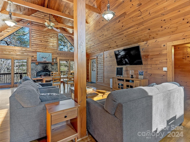 living room featuring ceiling fan, wooden ceiling, light hardwood / wood-style flooring, high vaulted ceiling, and beamed ceiling