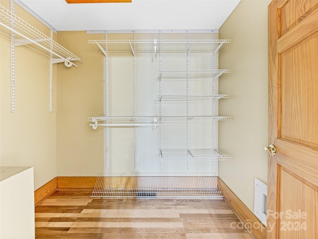 spacious closet featuring hardwood / wood-style floors