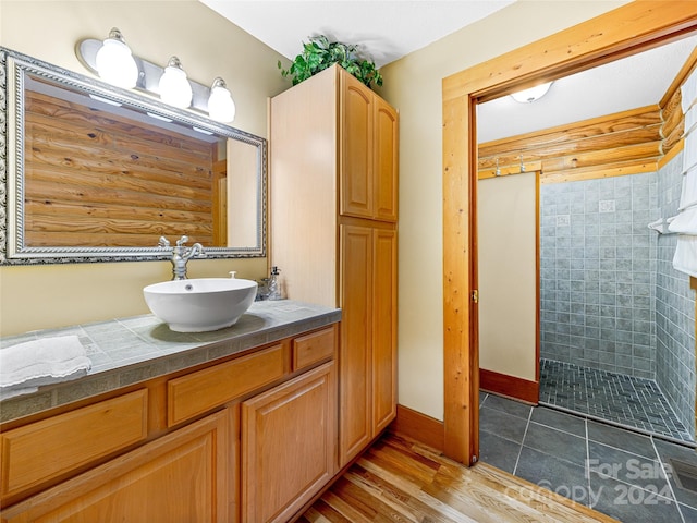 bathroom with vanity and hardwood / wood-style flooring