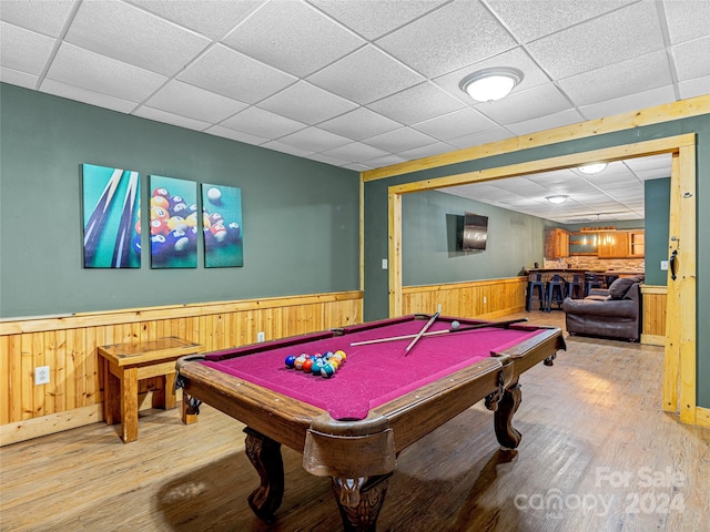 recreation room with hardwood / wood-style floors, a drop ceiling, and billiards