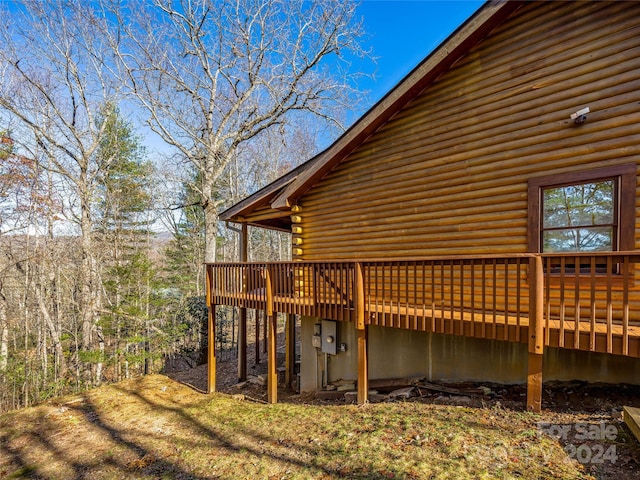 view of home's exterior with a wooden deck