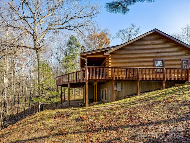 back of house featuring a deck