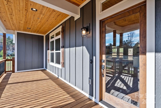 view of exterior entry with covered porch