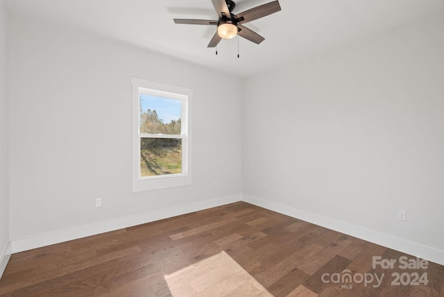 spare room featuring hardwood / wood-style flooring and ceiling fan