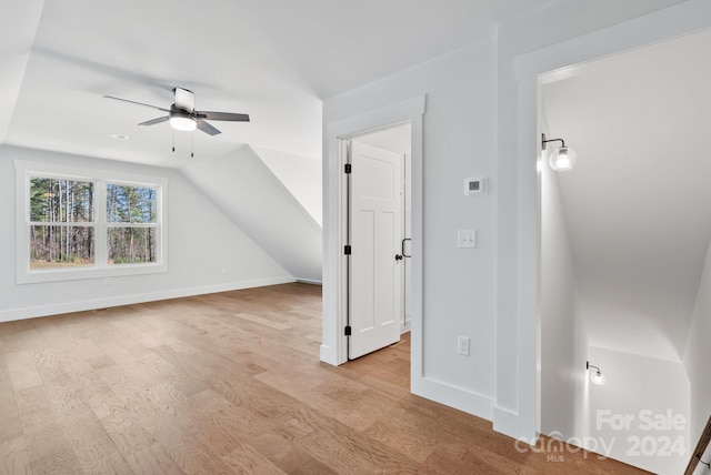 bonus room featuring ceiling fan, light hardwood / wood-style floors, and lofted ceiling