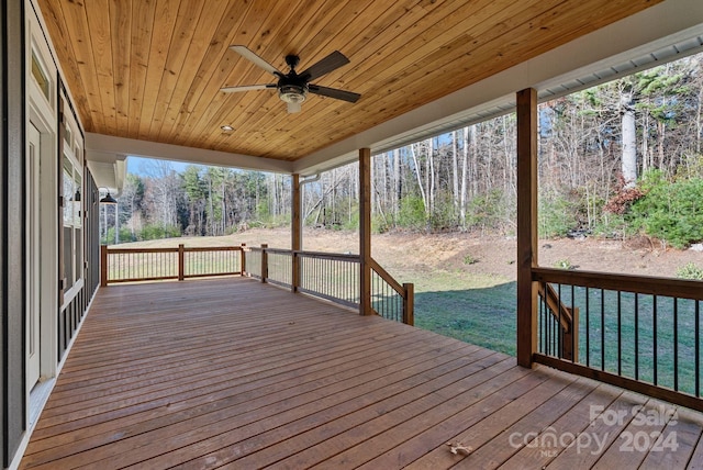 deck featuring a yard and ceiling fan