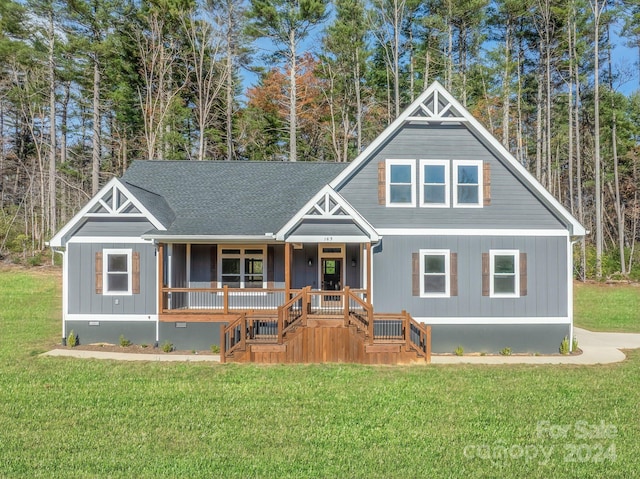 view of front of house with a front lawn and a porch