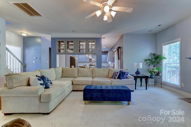 living room featuring ceiling fan