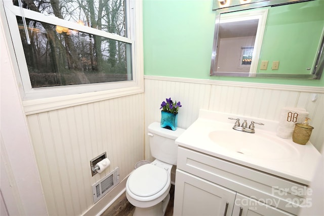 bathroom with vanity and toilet