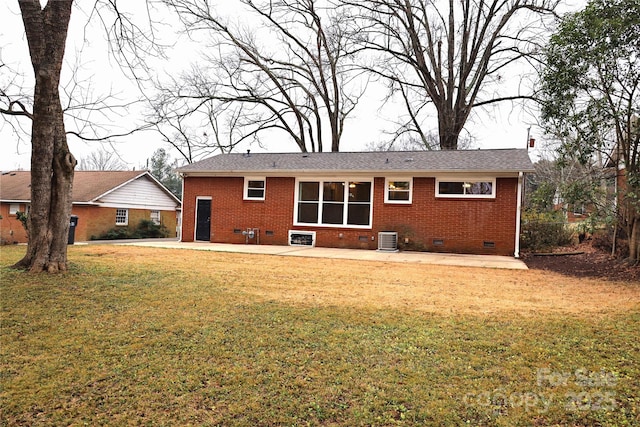 rear view of property with a lawn and central AC