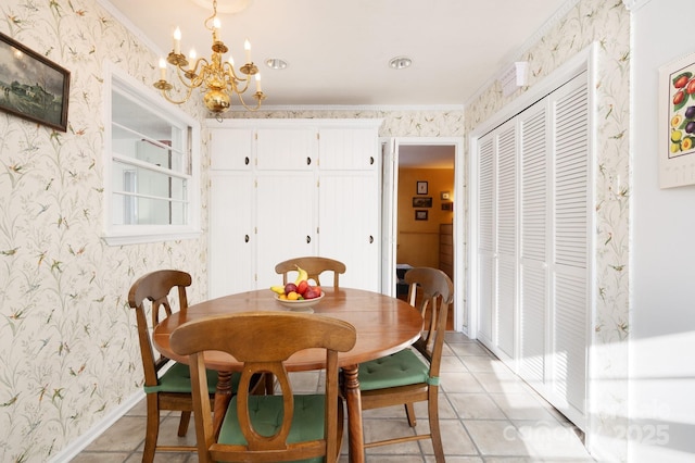 tiled dining room featuring a notable chandelier and ornamental molding