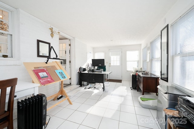 office featuring radiator and light tile patterned floors