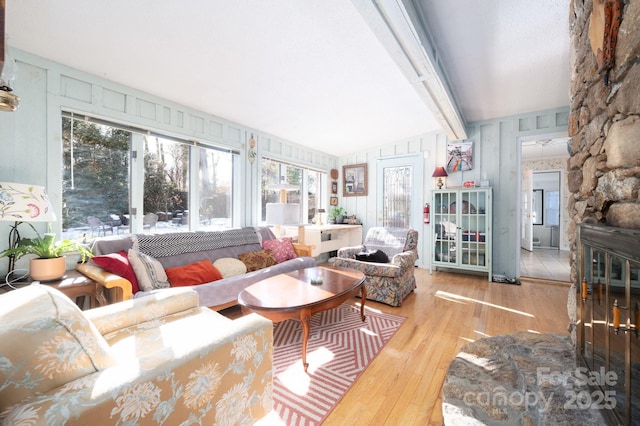 sunroom / solarium featuring vaulted ceiling