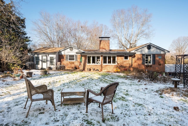 view of snow covered house