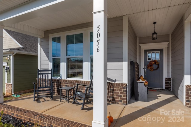 doorway to property with a porch