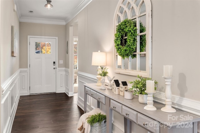 entrance foyer featuring dark wood-type flooring and ornamental molding