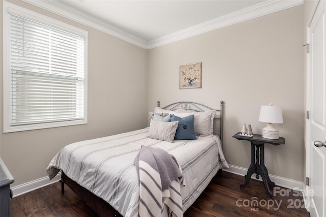 bedroom with multiple windows, crown molding, and dark hardwood / wood-style floors