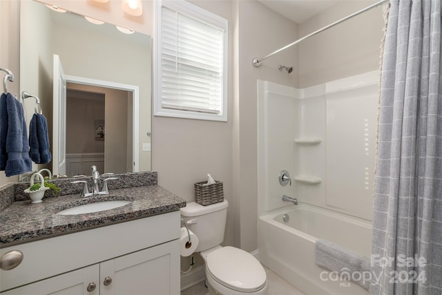 full bathroom with vanity, toilet, and shower / bath combo with shower curtain