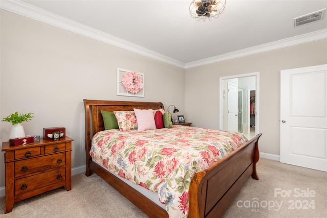 bedroom with light carpet and crown molding