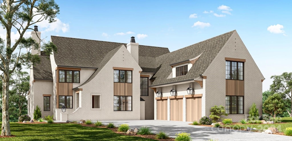 view of front of property featuring a garage and a front lawn