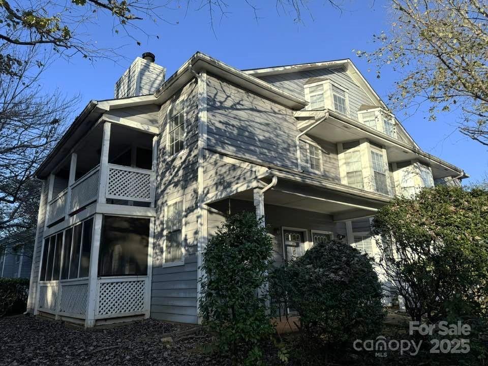 6017 Treetop Ct, Charlotte, NC 28212 - view of home's exterior with a chimney