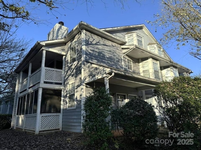 view of home's exterior with a chimney