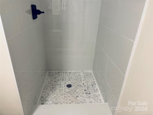 bathroom with a tile shower