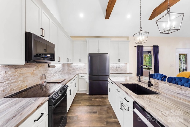 kitchen with decorative backsplash, dark wood-type flooring, black appliances, decorative light fixtures, and white cabinetry