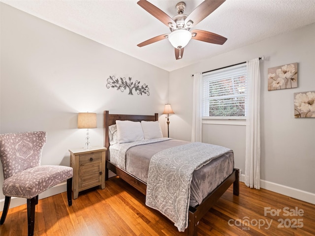 bedroom featuring ceiling fan and wood-type flooring