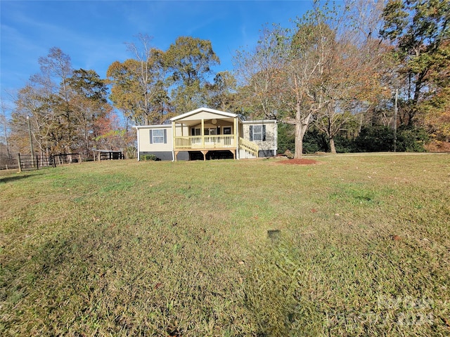 exterior space featuring a yard and covered porch