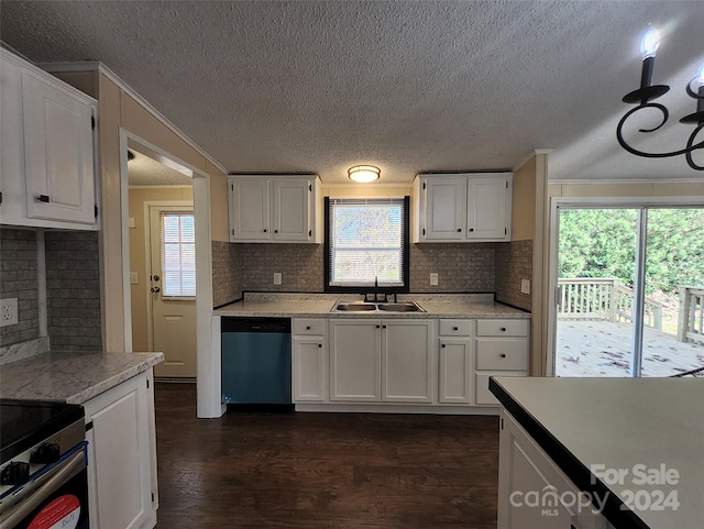 kitchen with appliances with stainless steel finishes, white cabinetry, and sink