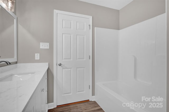 bathroom featuring vanity and wood-type flooring