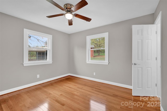 unfurnished room featuring ceiling fan and light hardwood / wood-style flooring