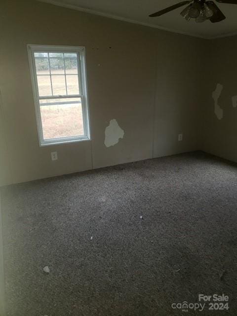 unfurnished room featuring ceiling fan