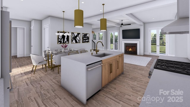 kitchen featuring open floor plan, a sink, wall chimney range hood, and dishwasher