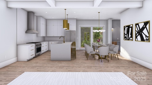 kitchen featuring stainless steel stove, a sink, light countertops, beam ceiling, and wall chimney exhaust hood