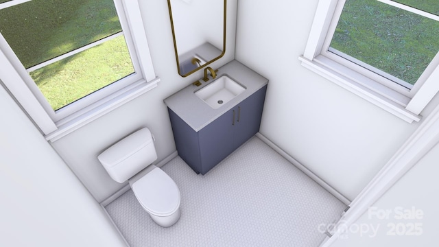 interior space with toilet and vanity