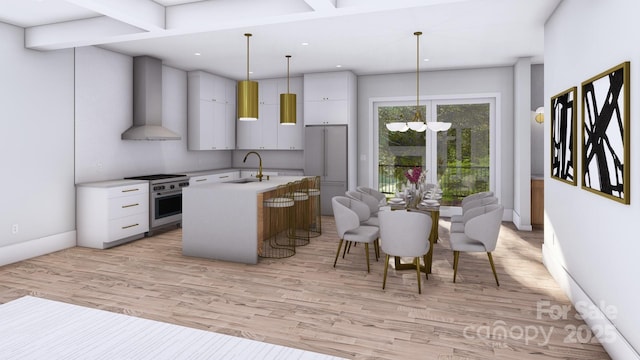 kitchen with a center island with sink, stainless steel range, wall chimney exhaust hood, light countertops, and a sink