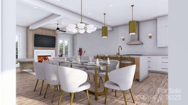 dining area with a large fireplace, light wood-style flooring, beamed ceiling, and recessed lighting