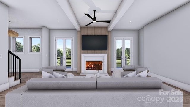 living area with a lit fireplace, french doors, wood finished floors, and beam ceiling