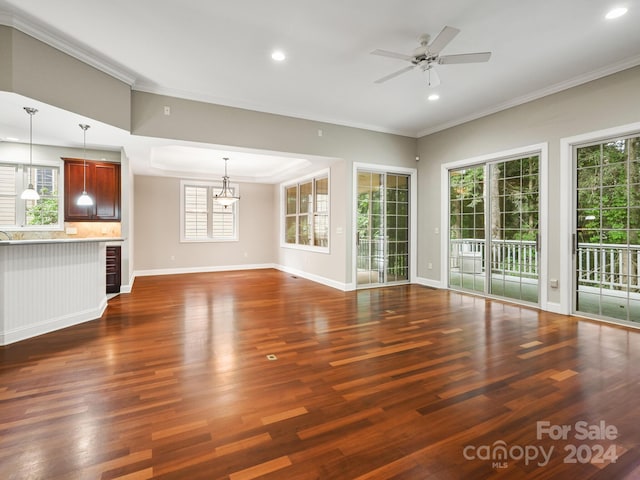 unfurnished living room featuring ceiling fan, dark hardwood / wood-style flooring, beverage cooler, and ornamental molding