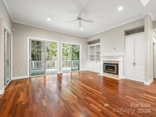 unfurnished living room with hardwood / wood-style floors, ceiling fan, and ornamental molding