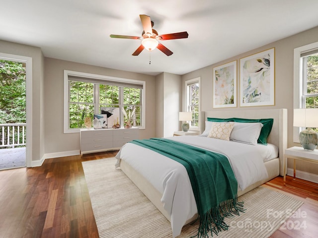 bedroom with access to outside, ceiling fan, and wood-type flooring