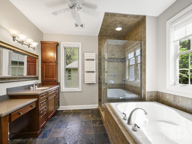 bathroom with separate shower and tub, radiator, a wealth of natural light, and vanity