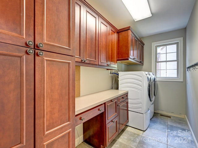 laundry area featuring cabinets and separate washer and dryer