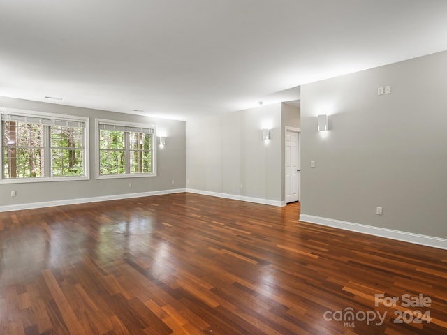 spare room featuring dark hardwood / wood-style flooring