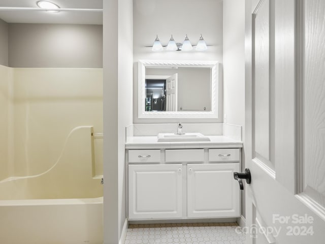 bathroom featuring vanity and bathing tub / shower combination