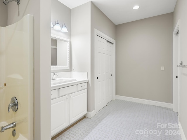 bathroom with vanity and bathing tub / shower combination