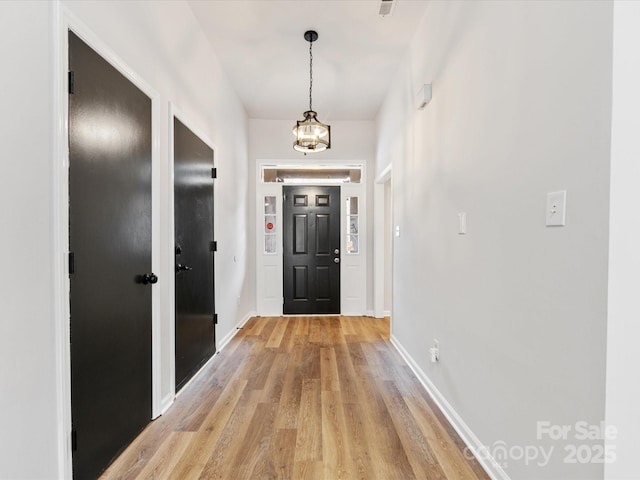 foyer entrance featuring light wood-type flooring