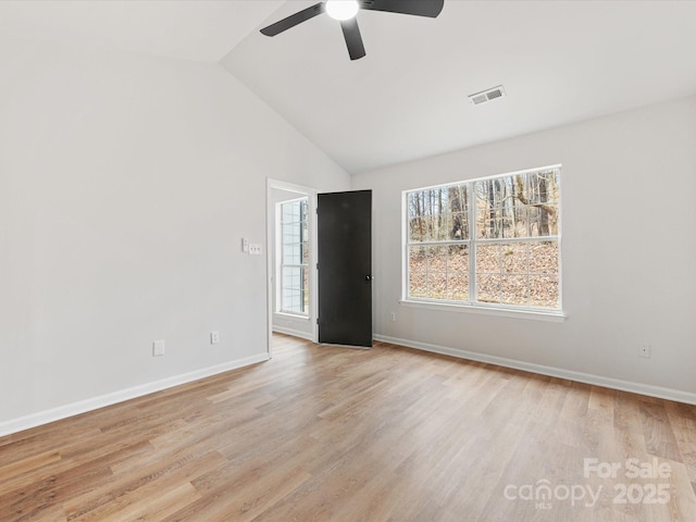 unfurnished room with vaulted ceiling, ceiling fan, and light hardwood / wood-style flooring